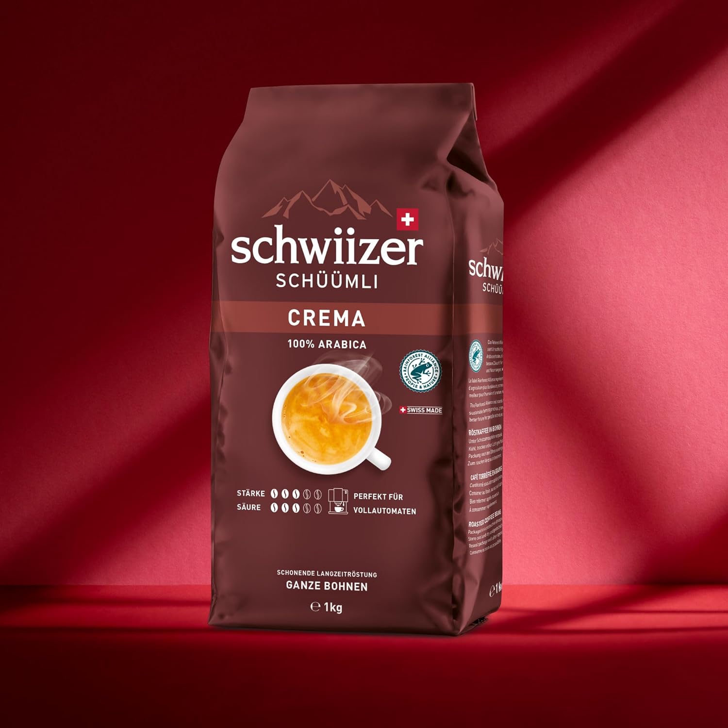 Schwiizer Schüümli Crema, 100% Arabica Kaffeebohnen, Aromatisch-Vollmundig, Ideal Für Vollautomaten, Stärke 3/5, Mittlere Röstung, Rainforest Alliance, 1Kg